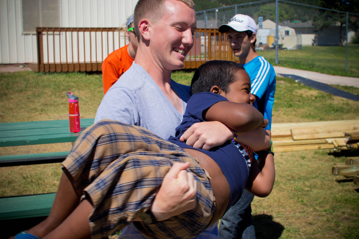 Student Holding Kid