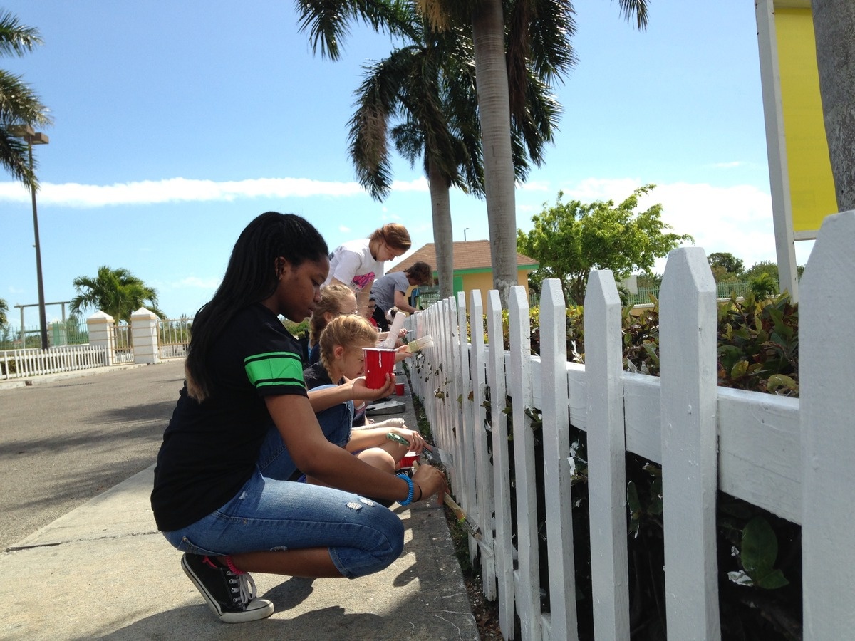Student Painting Fence