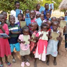 Distribution of books pens and pencils to vulnerable children