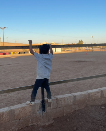 Middle East Kid on Fence.jpg