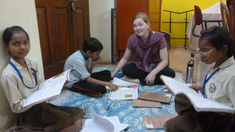 Another ACTION Intern Apprentice helping with the children in the neighborhood