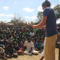 A short-term worker sharing the Gospel in a Malawian village 